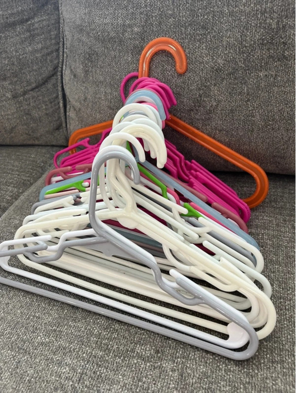 Around 30 kids clothes hangers